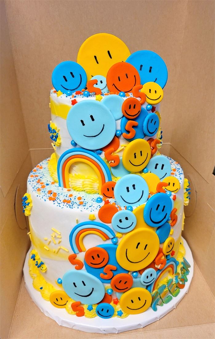 Two-tier emoji themed birthday cake