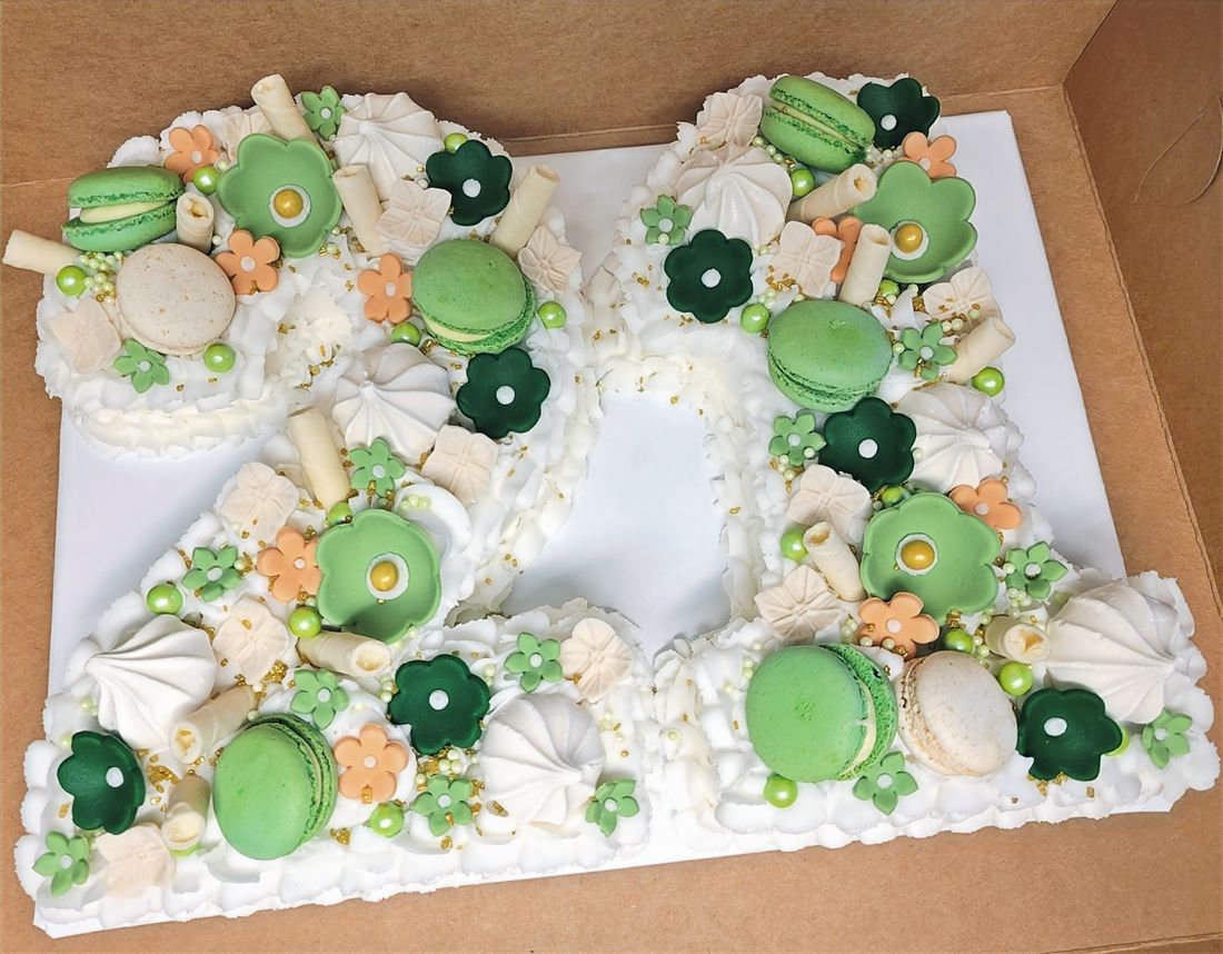 Sheet cake decorated with frogs and lily pads