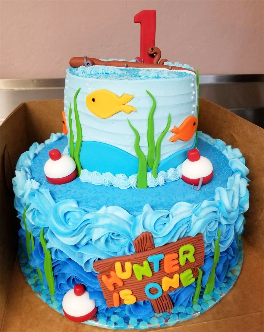 Under the sea first birthday cake with fish and bubbles