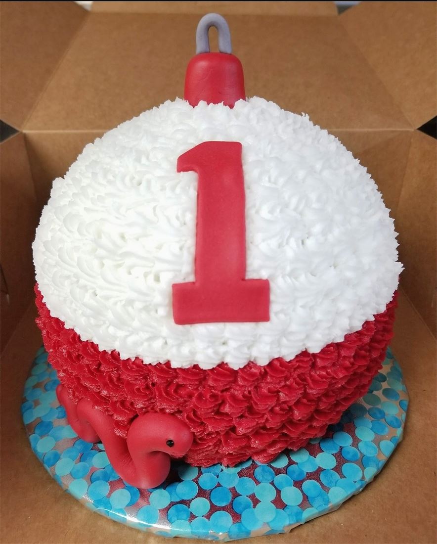 Red and white first birthday smash cake
