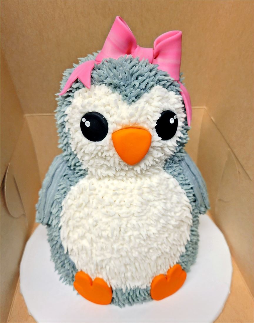 Sculpted penguin birthday cake