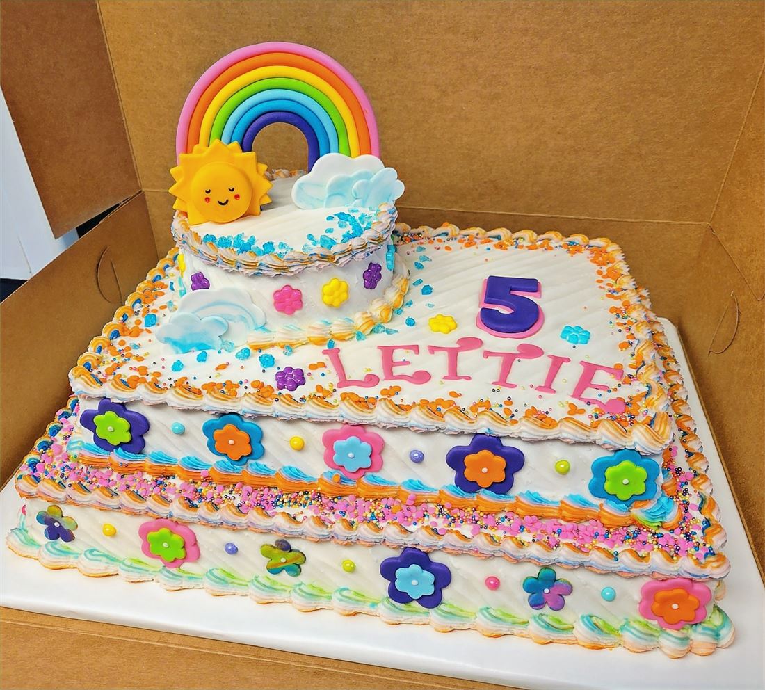 Rainbow and flower fifth birthday sheet cake