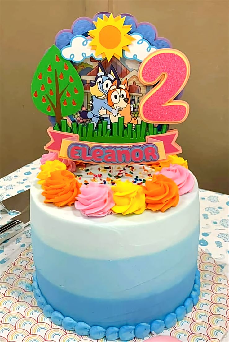Second birthday cake with a sunflower and farm animals