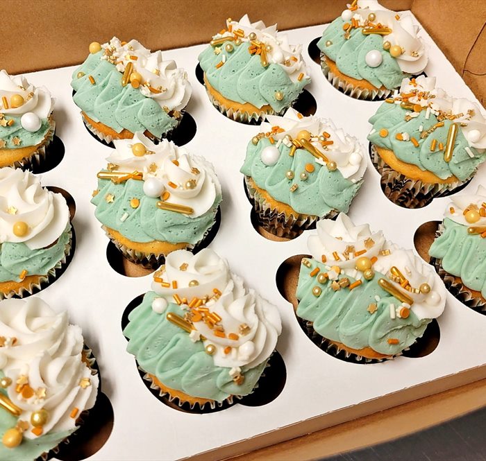 Tray of Sweet Shop cupcakes finished with swirled frosting