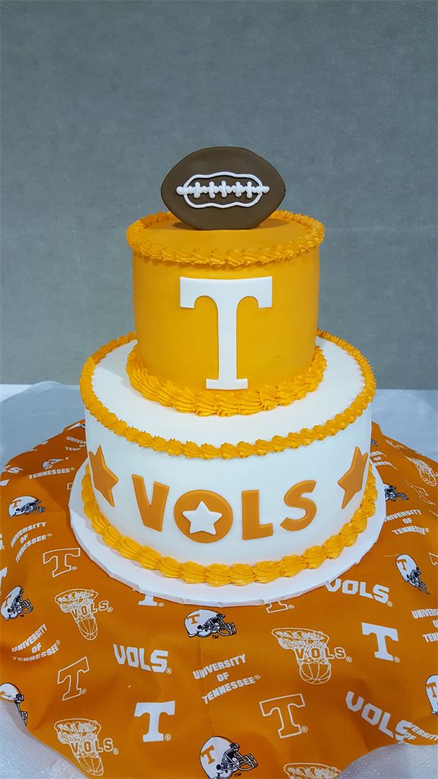 Tennessee Volunteers groom cake shaped like an orange football helmet