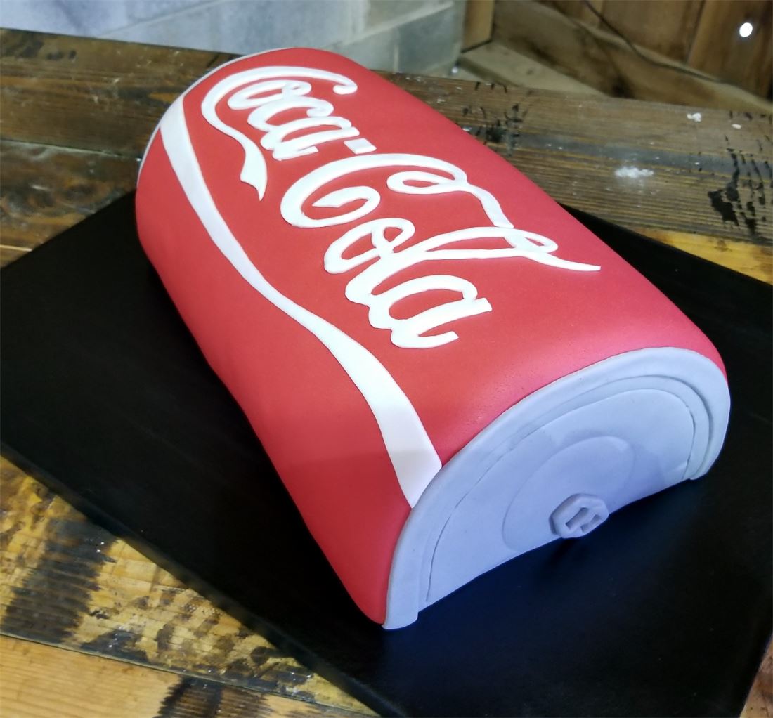 Groom cake sculpted as a Coca-Cola bottle