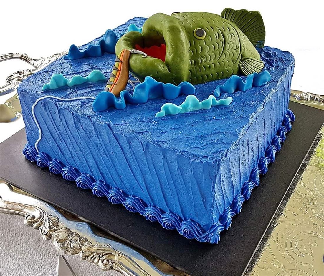 Blue pool themed sheet cake with an alligator