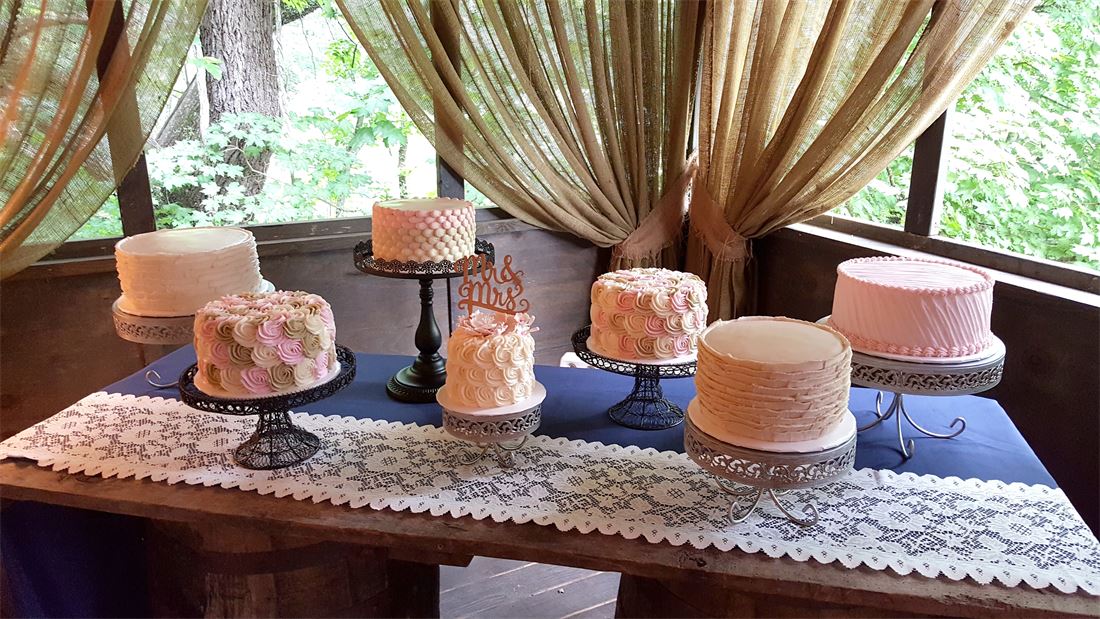 Dessert table set with an assortment of small cakes and treats