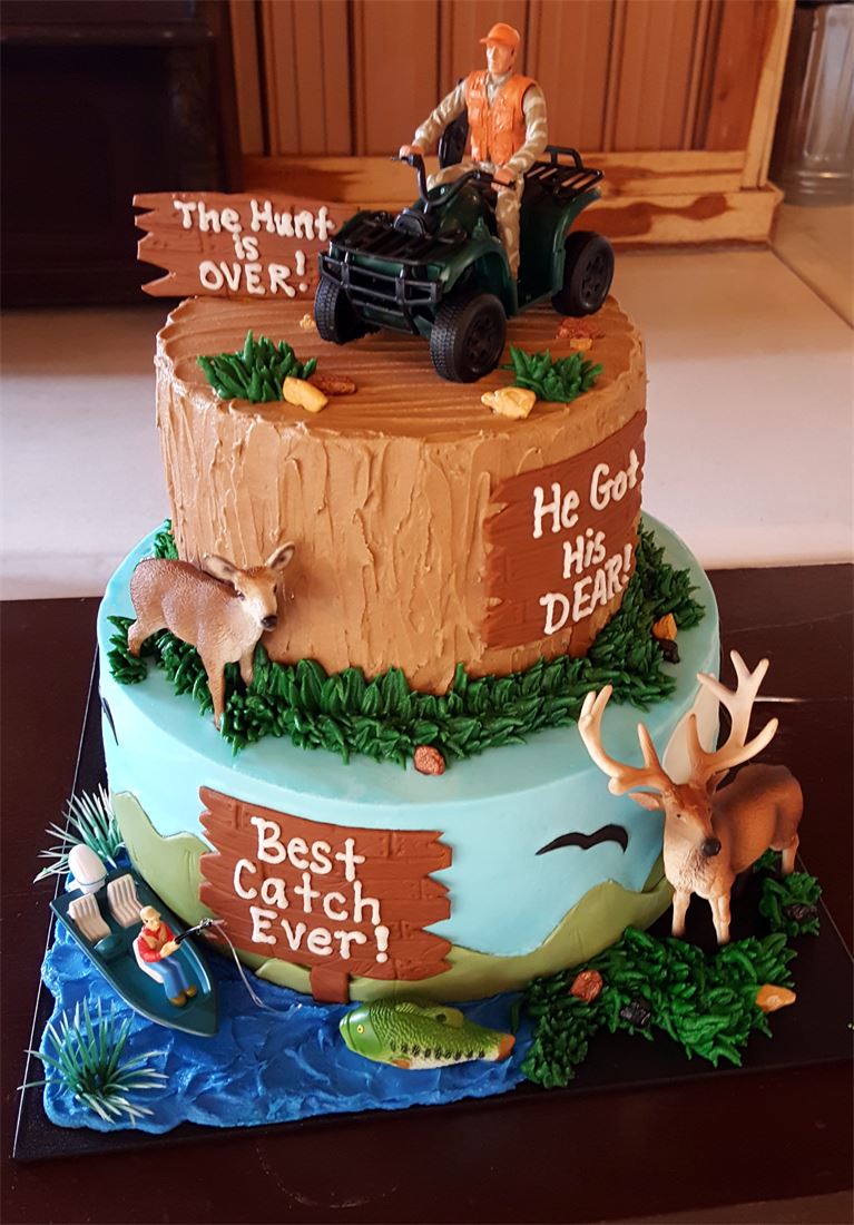 Rustic hunting themed groom cake with deer and a lantern
